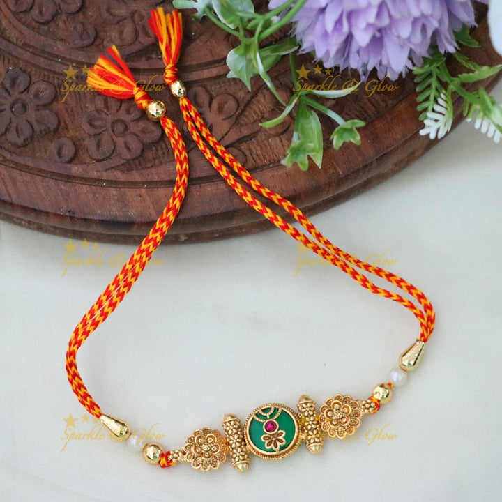 Gold Rakhi Bracelet for a Touch of Festive Elegance