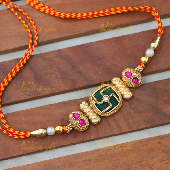 Elegant Rakhi with Gold Swastika Motif for Festivities