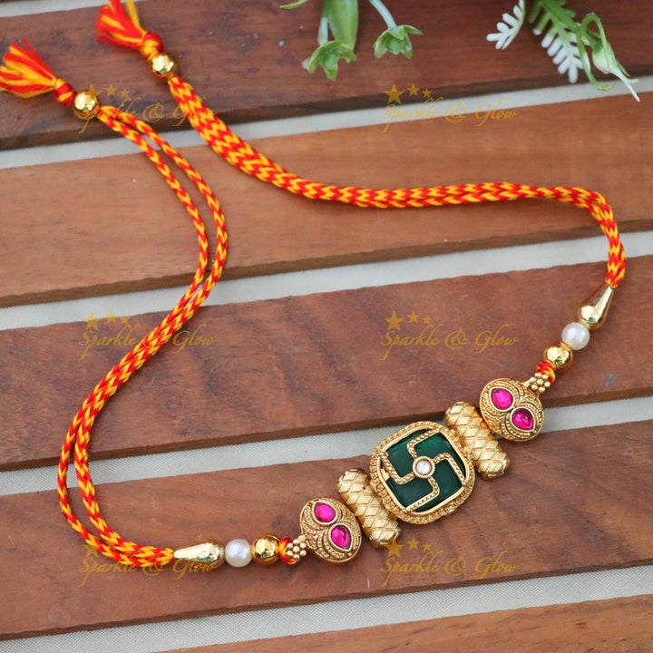 Elegant Rakhi with Gold Swastika Motif for Festivities