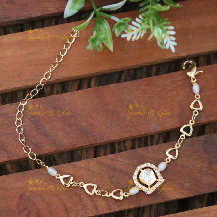Elegant Gold-Toned Heart Rakhi for Festive Celebrations