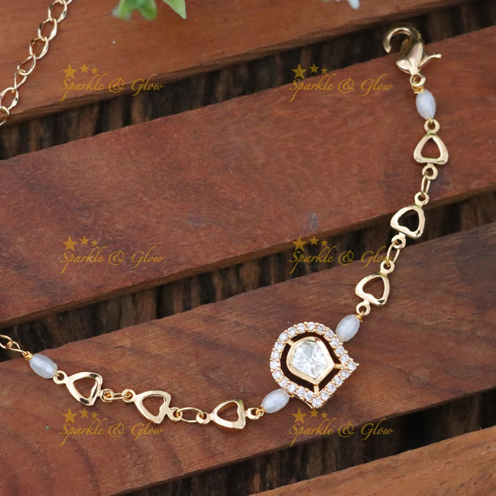 Elegant Gold-Toned Heart Rakhi for Festive Celebrations