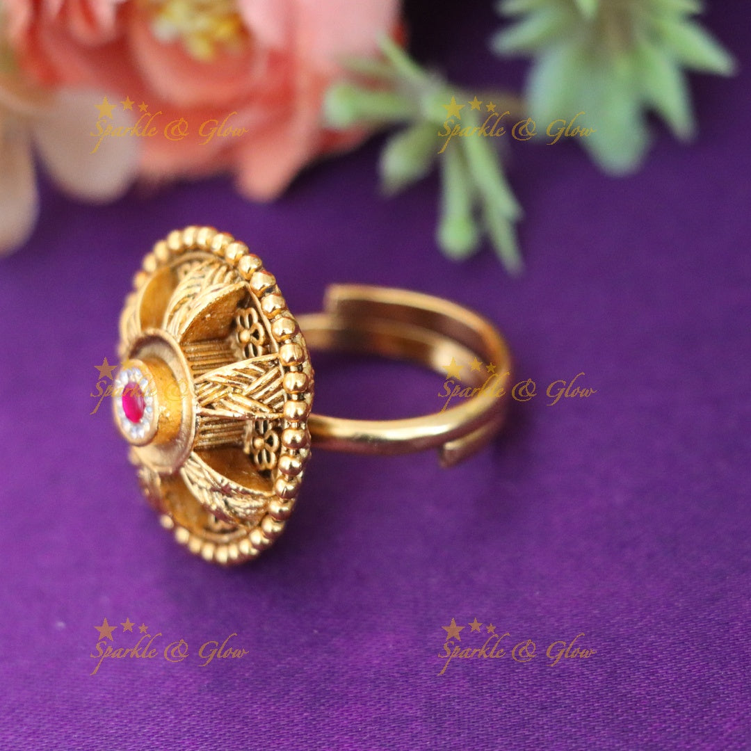 Elegant Gold Floral Finger Ring with Ruby Accent