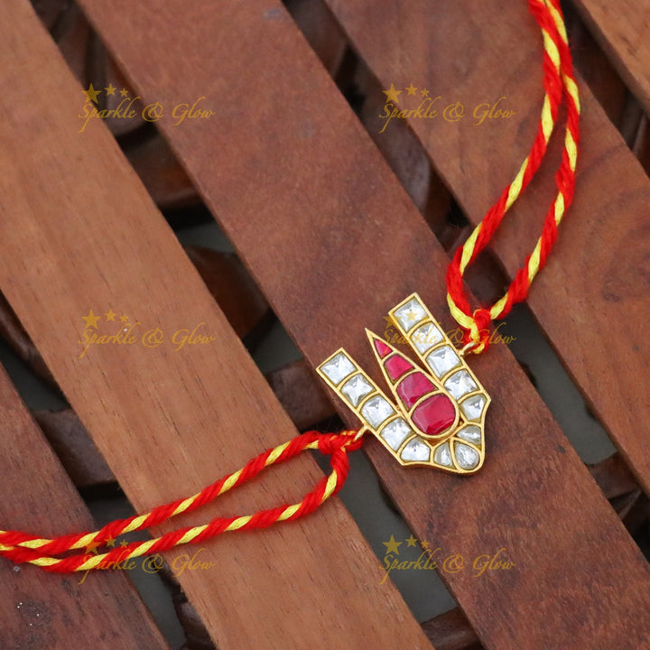 Exquisite Gold Rakhi with Traditional Design