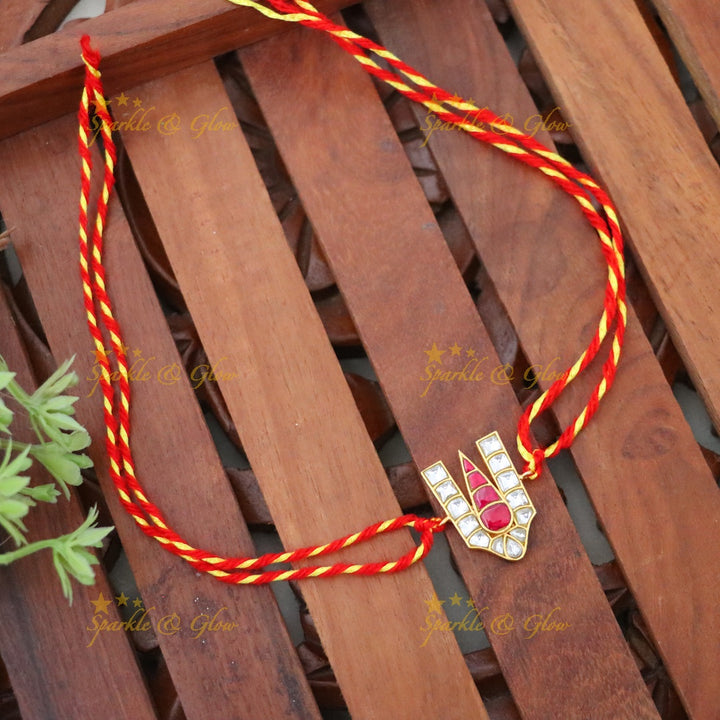 Exquisite Gold Rakhi with Traditional Design