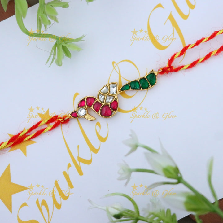 Exquisite Gold Polish Rakhi with Peacock Design
