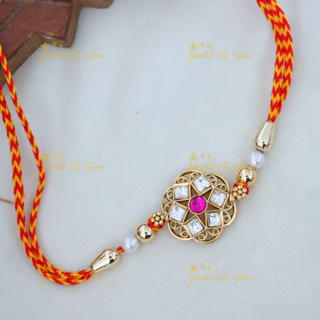Elegant Rakhi with Gold and Red Threads