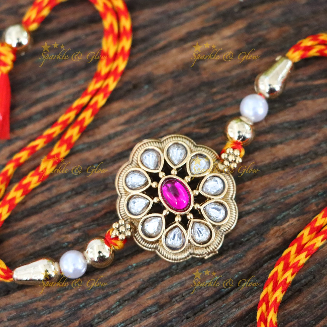 Elegant Rakhi with Gold Finish and Pearl Accents