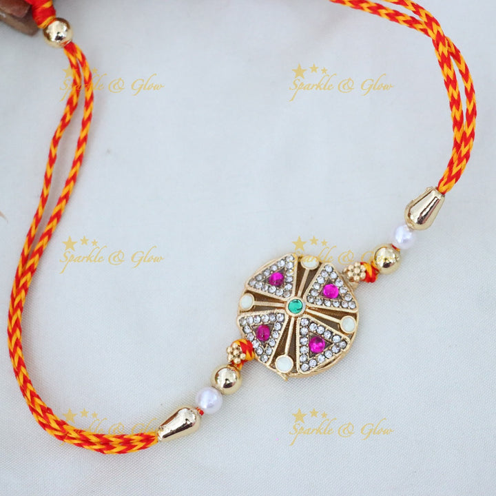 Elegant Gold-Toned Rakhi with Swarovski Crystals