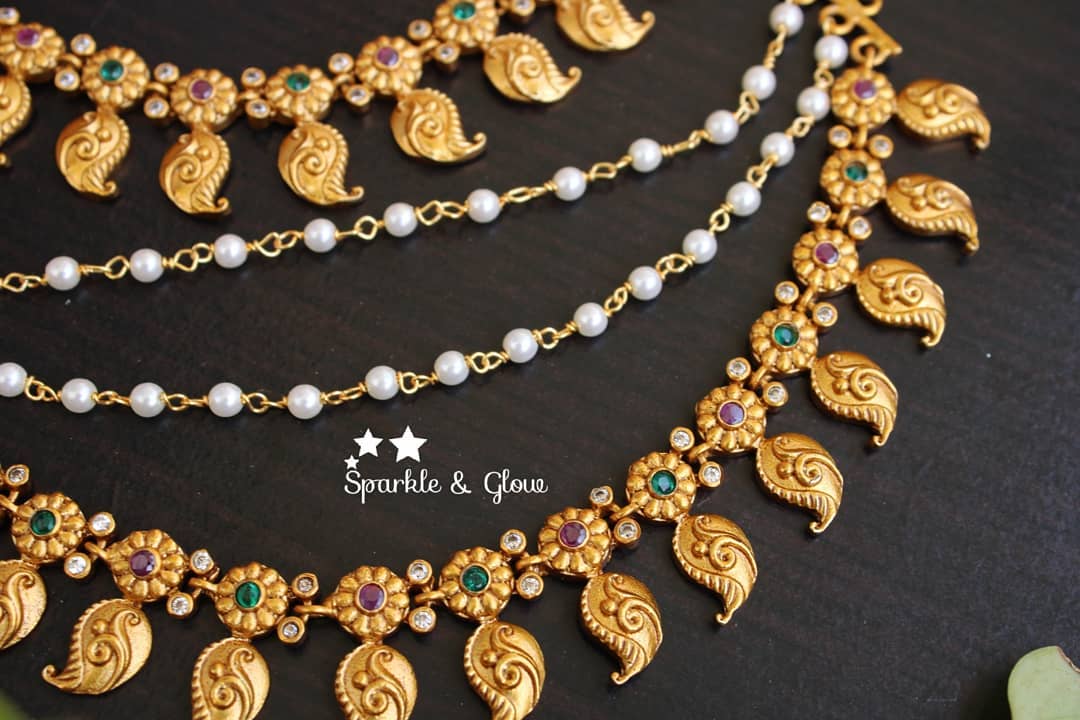 Mango and flower designed ear chain with stones