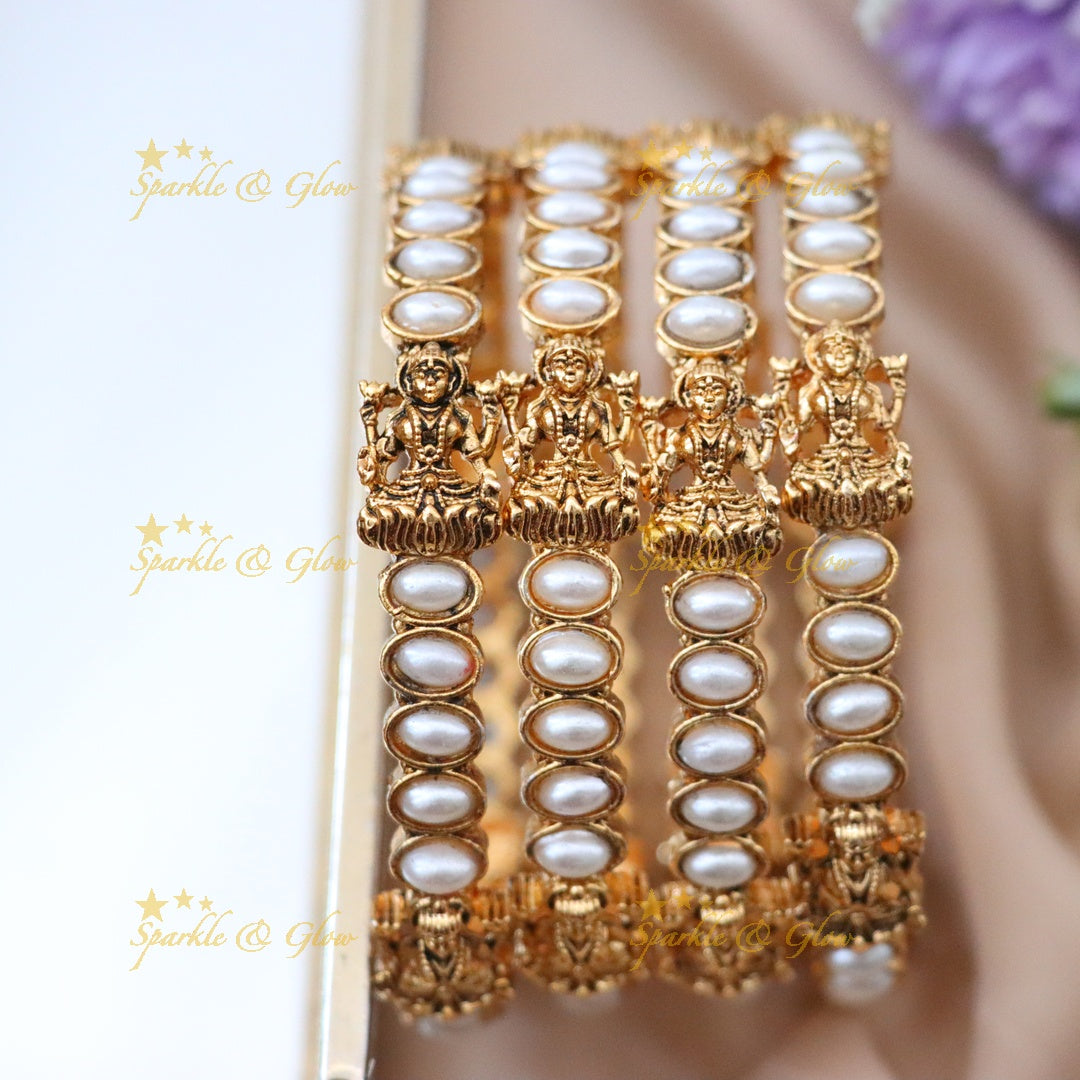 Temple Bangles with Idol Motifs for Festive Elegance