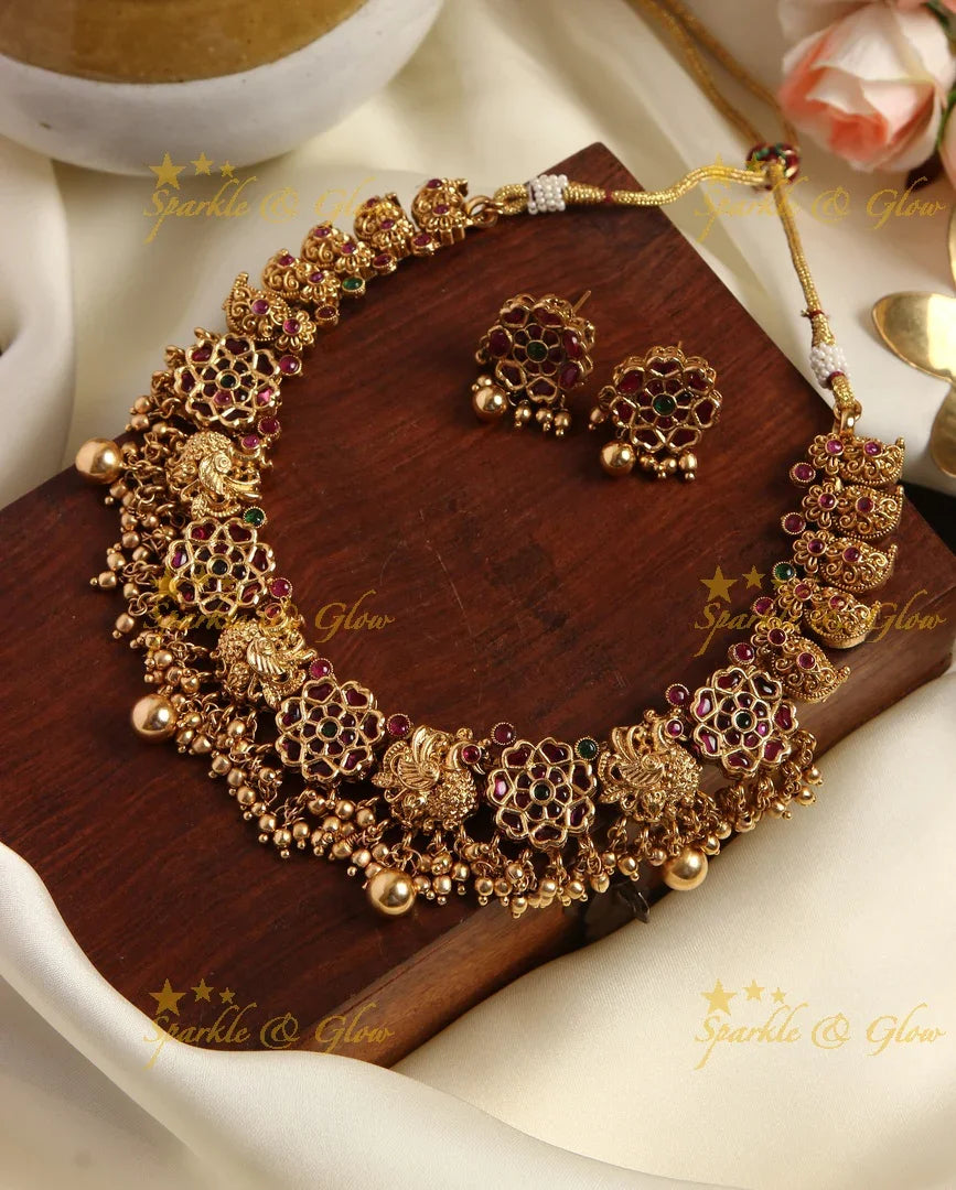 Gold alike kemp flower and peacock carved mango necklace - Sparkle and Glow