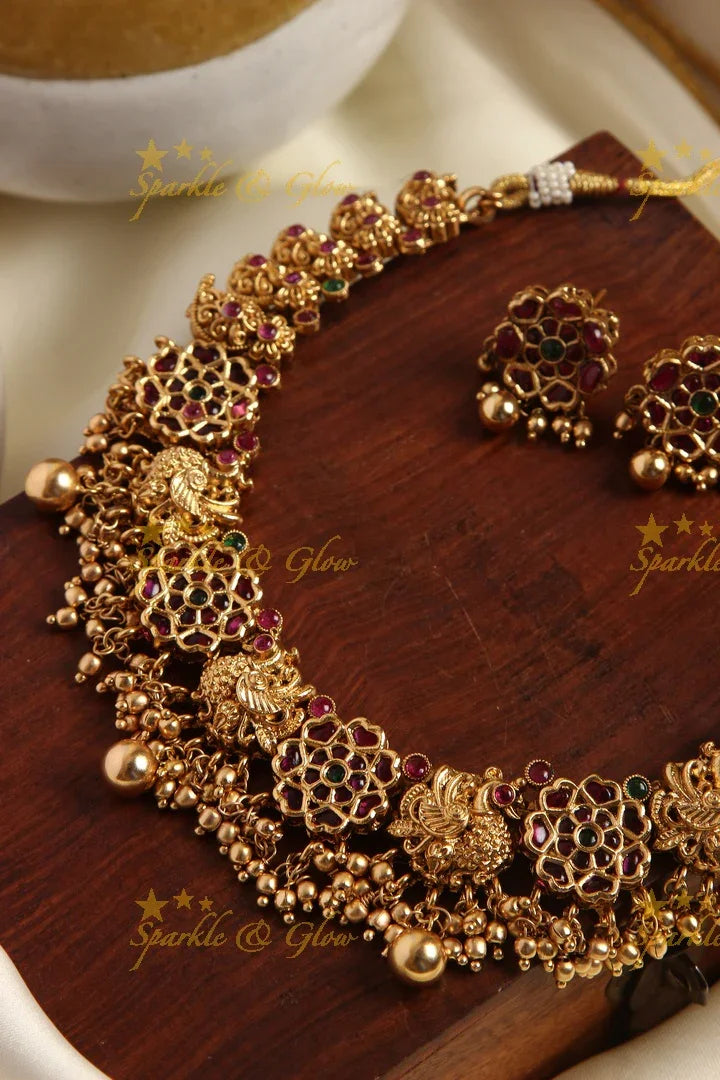 Gold alike kemp flower and peacock carved mango necklace - Sparkle and Glow