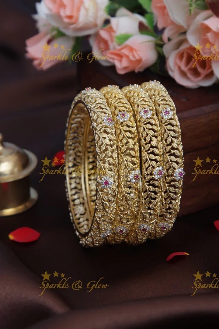 Gold stone leaf and flower carved bangles set of four - 2.8 - Sparkle and Glow