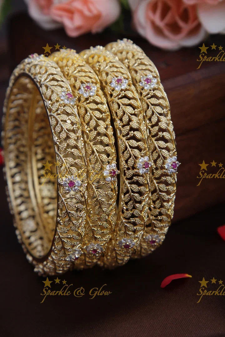 Gold stone leaf and flower carved bangles set of four - 2.8 - Sparkle and Glow