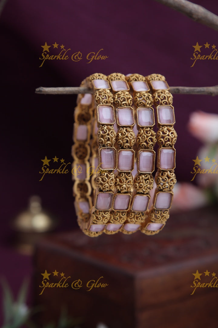 Gold alike stone bangles set of four