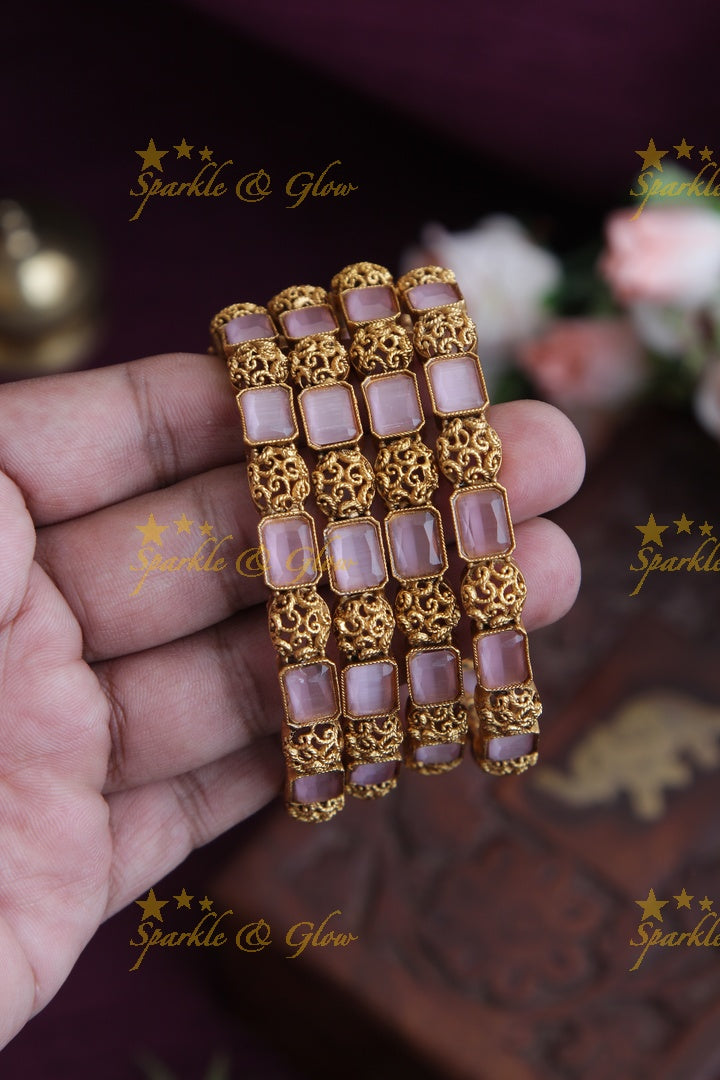Gold alike stone bangles set of four