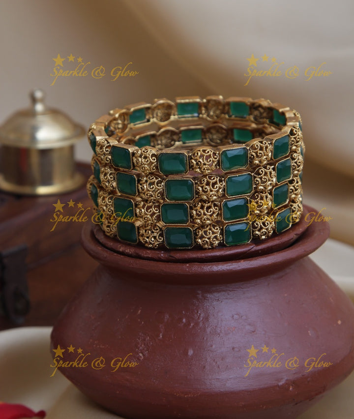 Gold alike stone bangles set of four