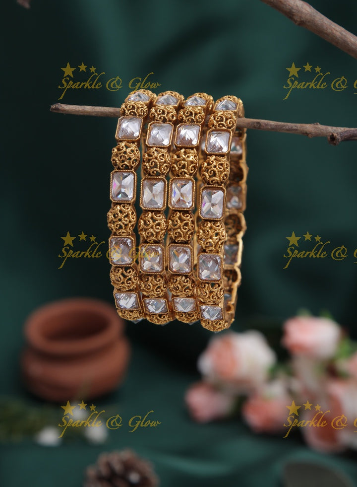 Gold alike stone bangles set of four