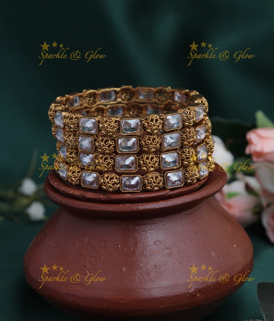 Gold alike stone bangles set of four