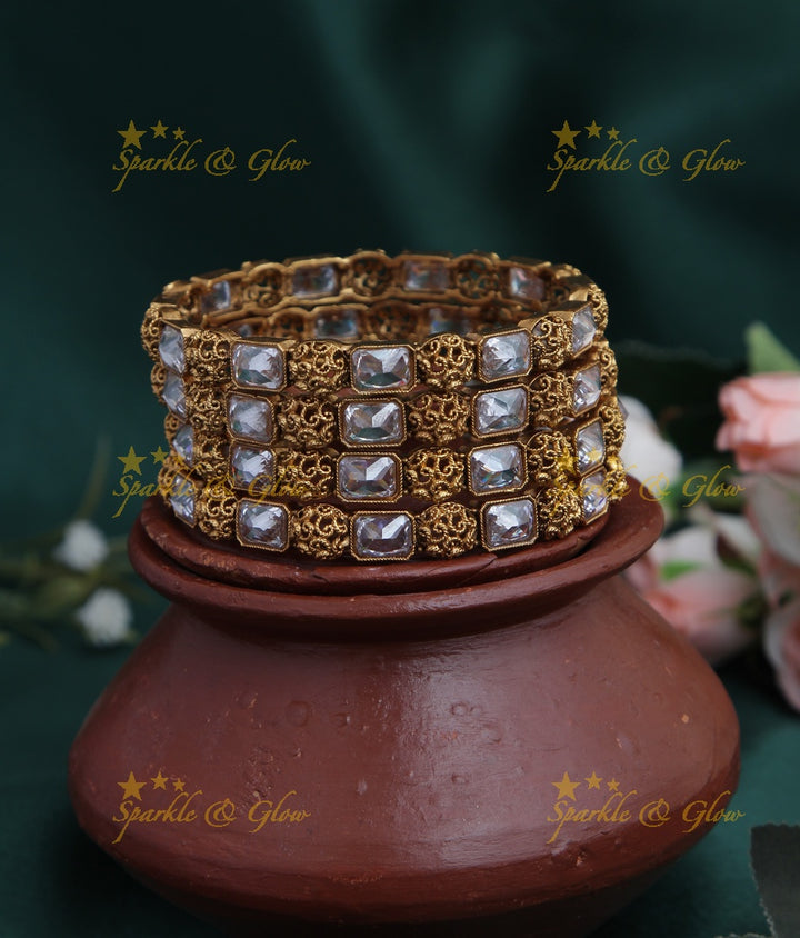 Gold alike stone bangles set of four