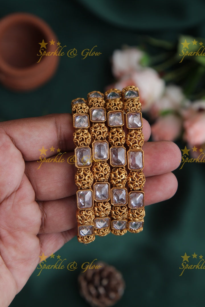 Gold alike stone bangles set of four