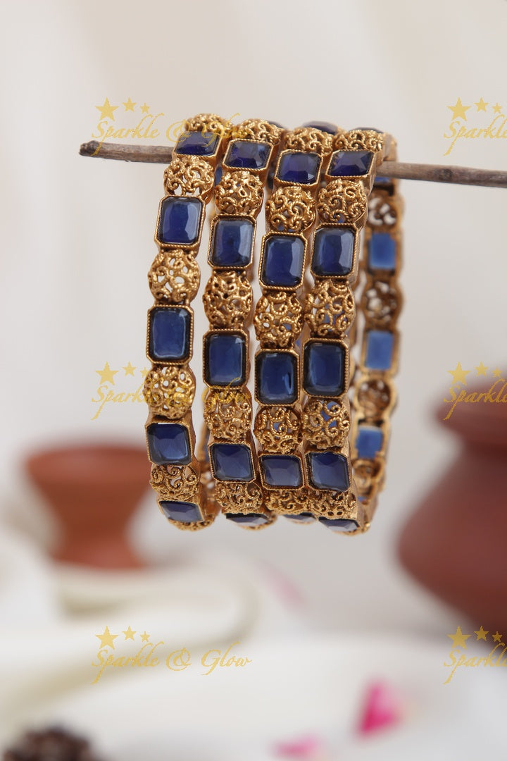 Gold alike stone bangles set of four
