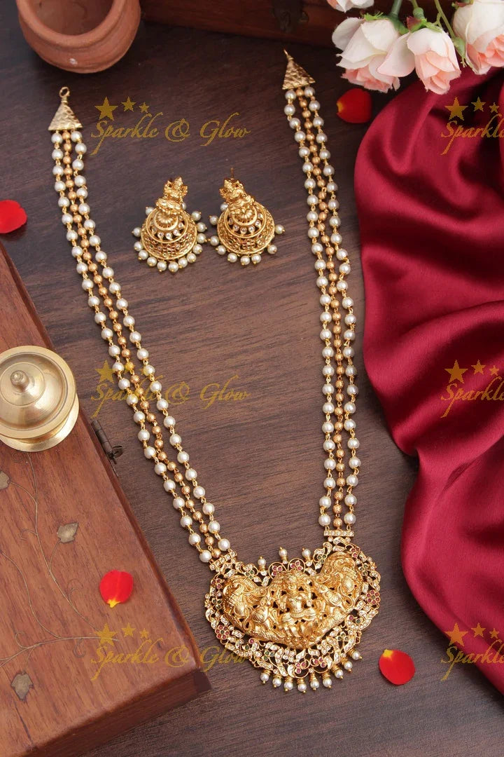 Layered gold beads with Intricately carved Lakshmi Peacock Elephant Pendent - Sparkle and Glow