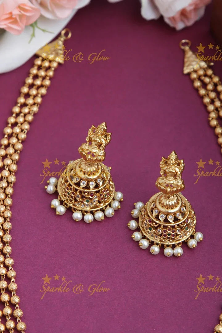 Layered gold beads with Intricately carved Lakshmi Peacock Elephant Pendent - Sparkle and Glow