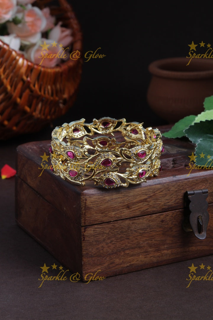 Gold polished leaf bangles a pair