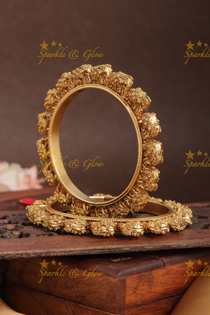 Gold alike intricate elephant bangle