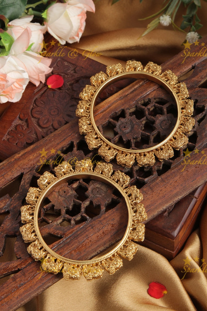 Gold alike intricate elephant bangle