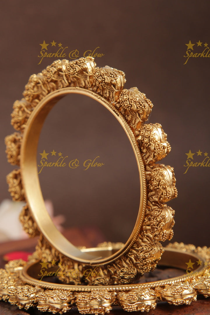 Gold alike intricate elephant bangle