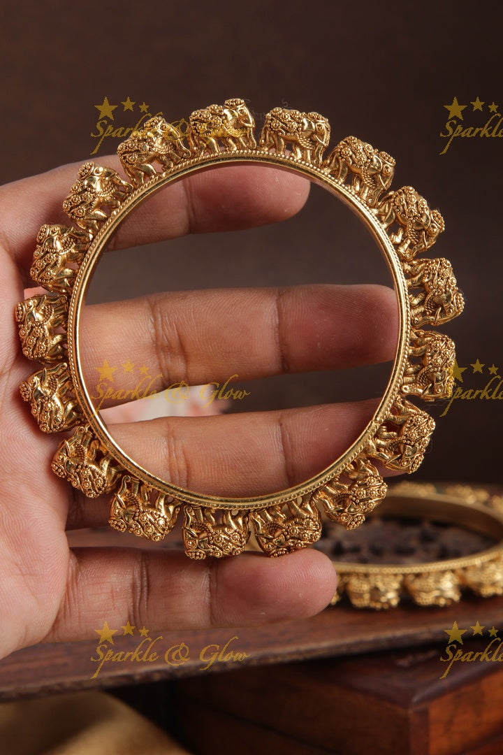 Gold alike intricate elephant bangle