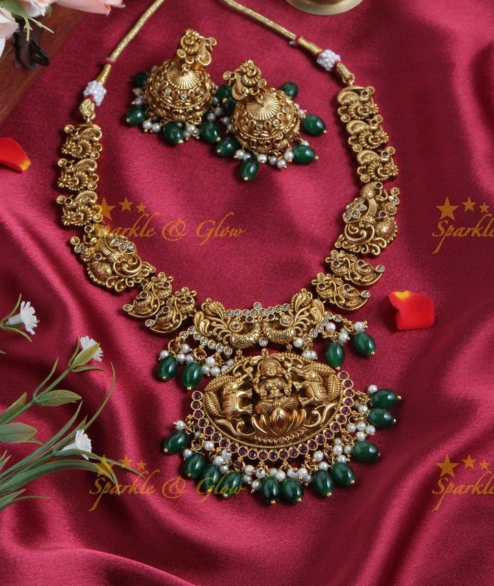 Intricately Carved Gold Alike Polished Lakshmi Elephant Short Necklace With Green Beads