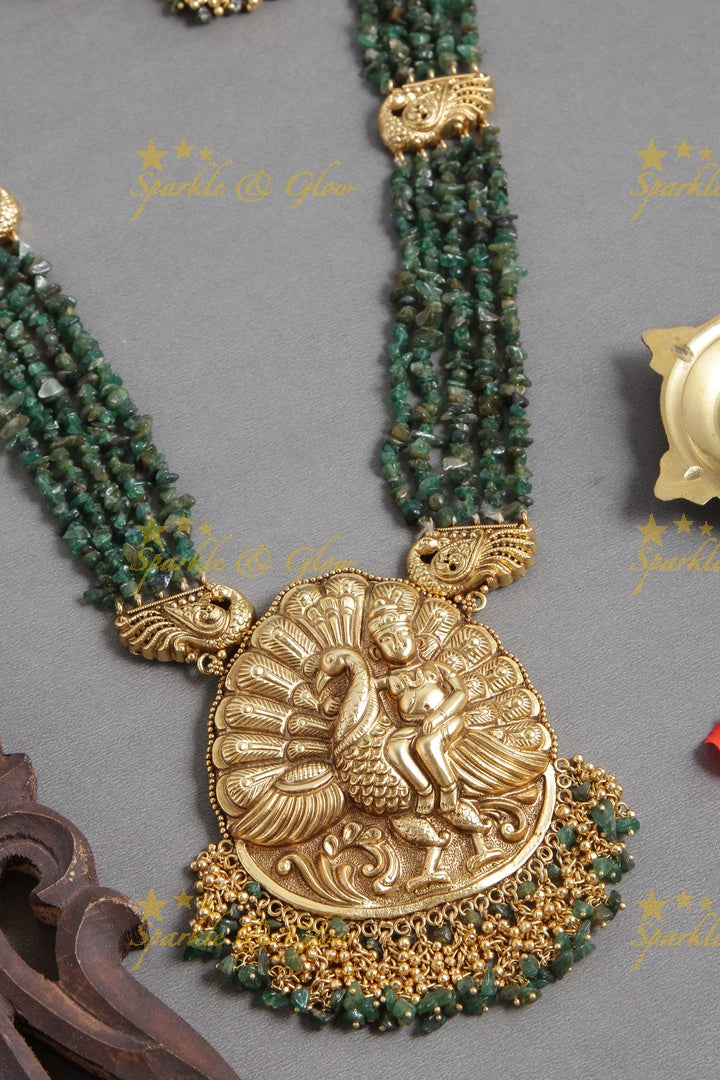 Gold Alike bead necklace with intricately carved peacock pendent