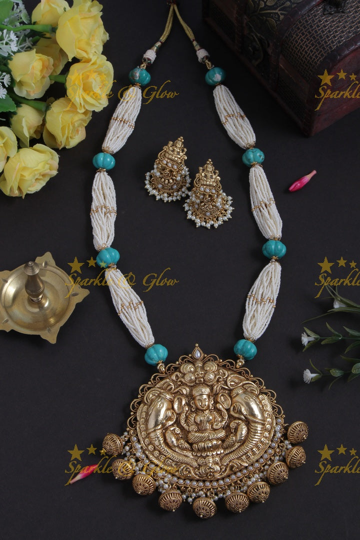 Beautiful Gold Alike bead necklace with intricately carved lakshmi ganesh pendent