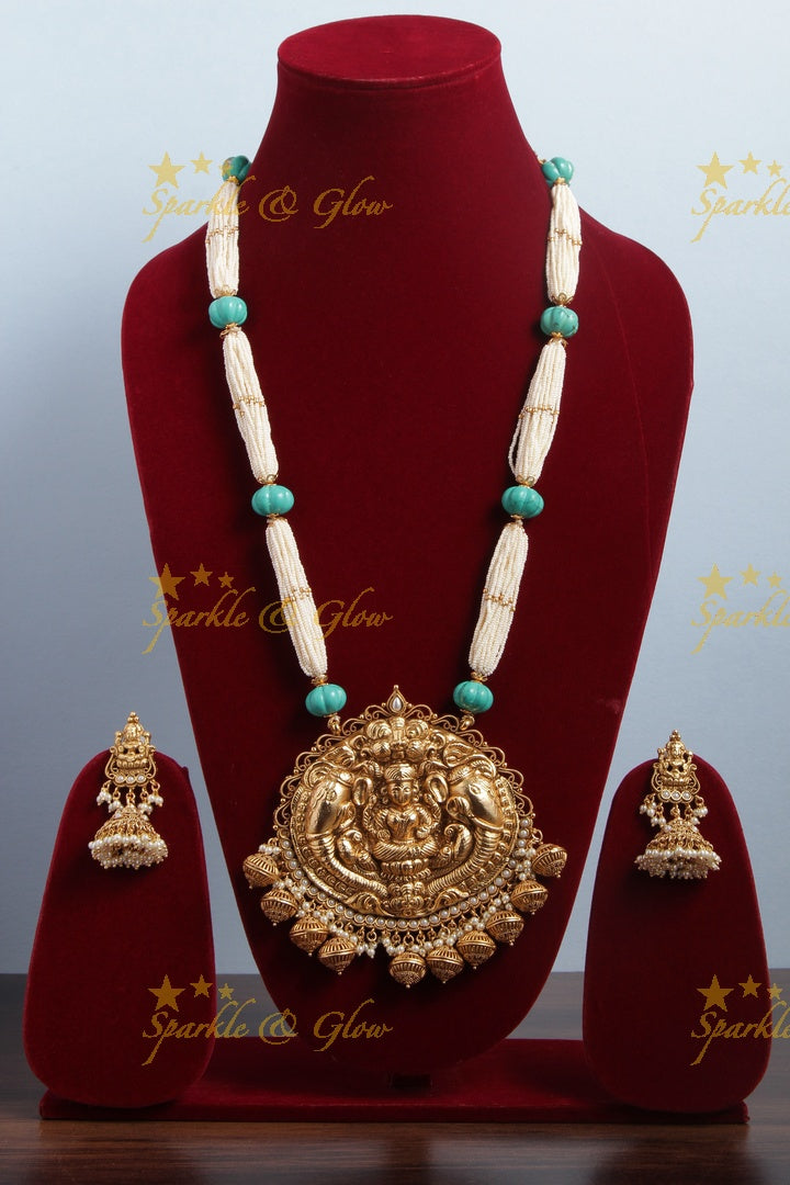 Beautiful Gold Alike bead necklace with intricately carved lakshmi ganesh pendent