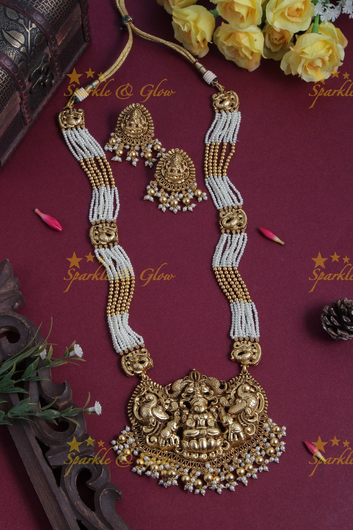 Gold Alike pearl and gold bead necklace with lakhsmi peacock pendent