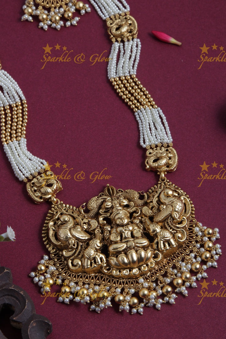 Gold Alike pearl and gold bead necklace with lakhsmi peacock pendent