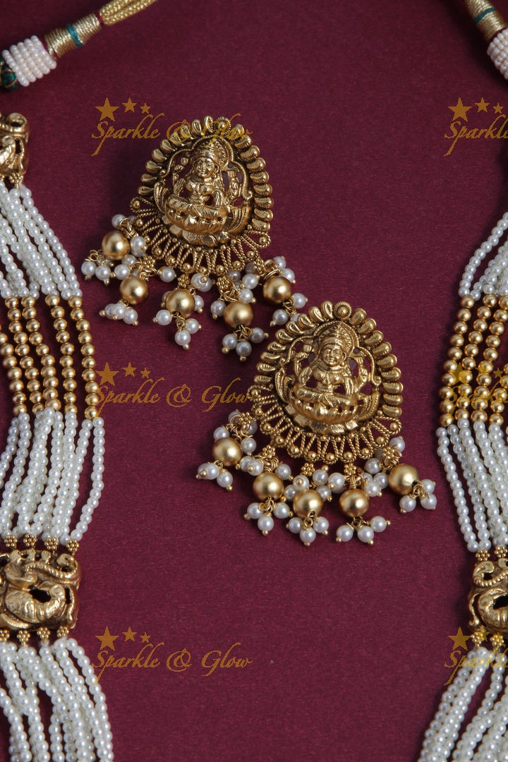 Gold Alike pearl and gold bead necklace with lakhsmi peacock pendent