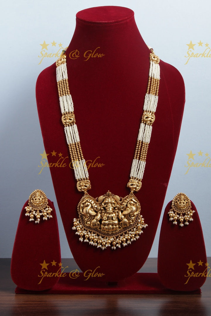 Gold Alike pearl and gold bead necklace with lakhsmi peacock pendent