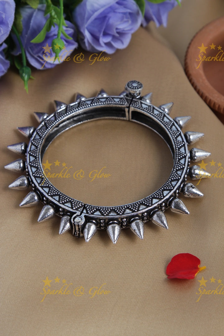 Silver look alike triangle design hook type screw bangle