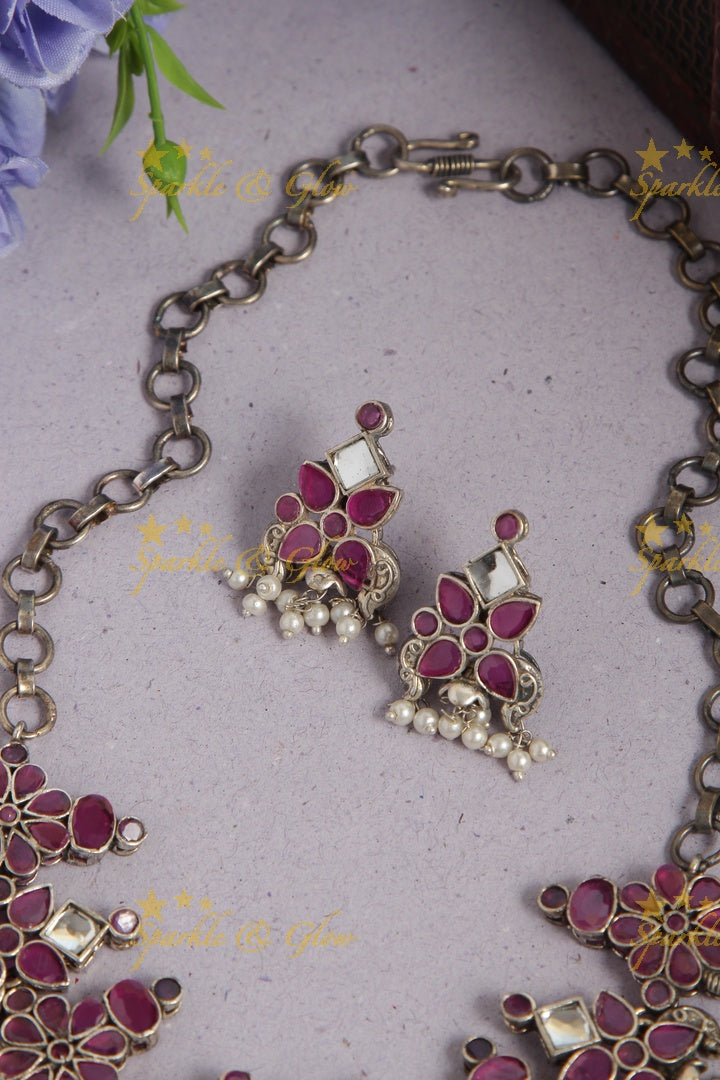 Silver look alike ruby like stone choker with pearl drops