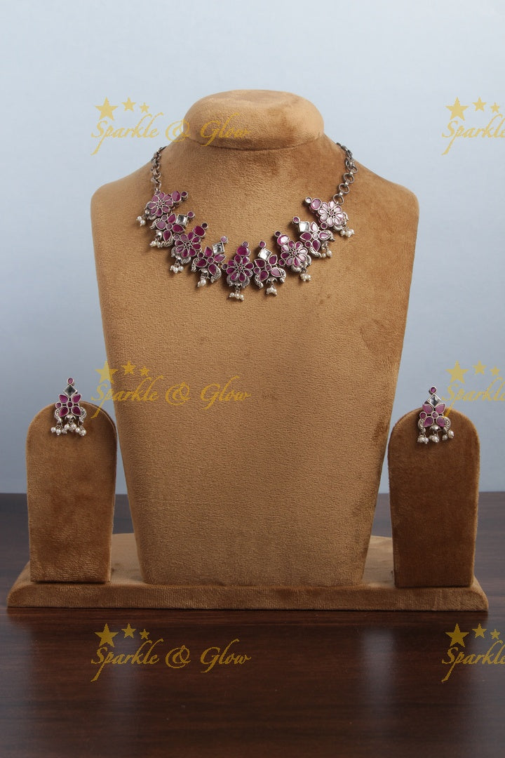 Silver look alike ruby like stone choker with pearl drops