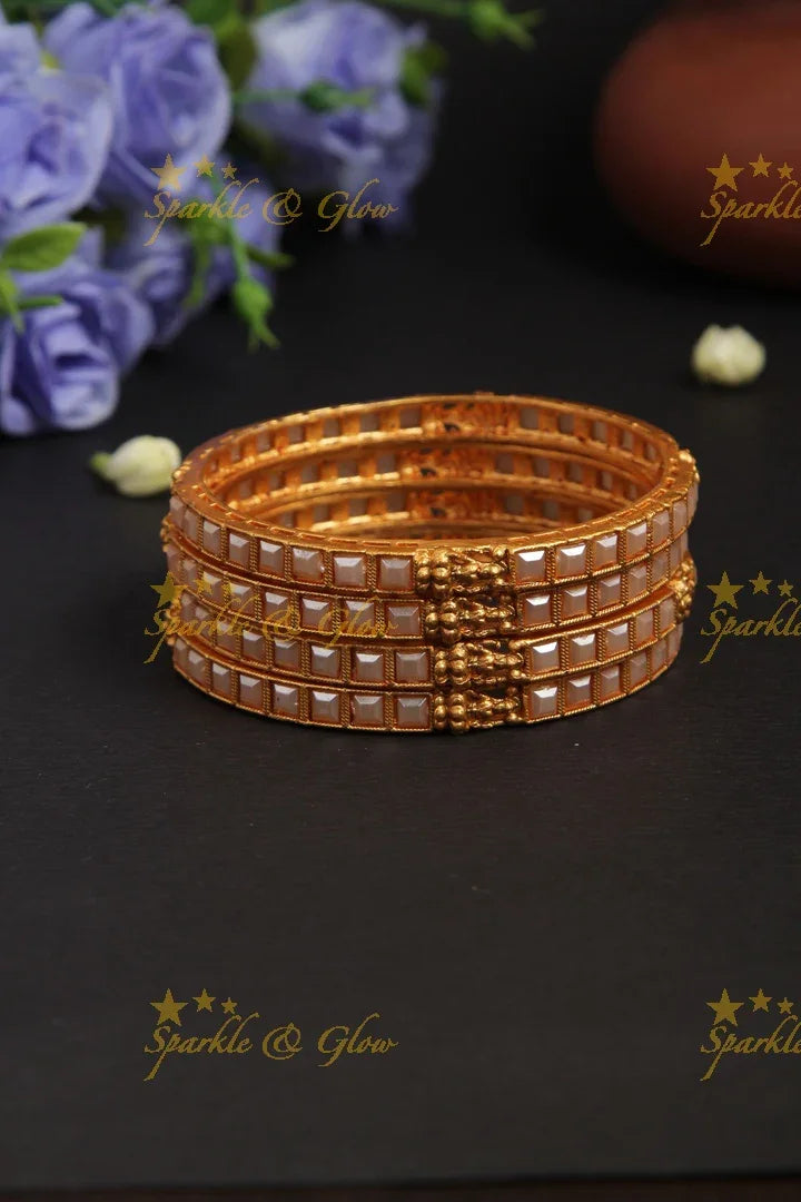 Budgetted pearl bangles set of 4 - 2.4 - Sparkle and Glow