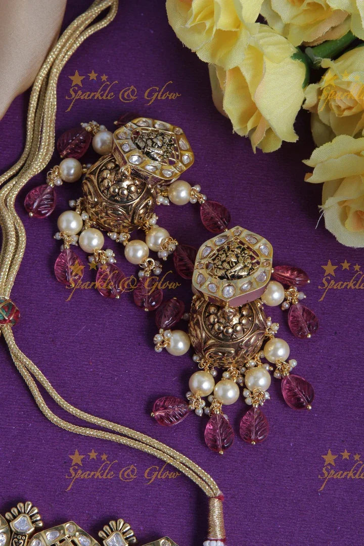 Intricately carved ganesh bead choker with pearls and green leaf beads - Pink - Sparkle and Glow