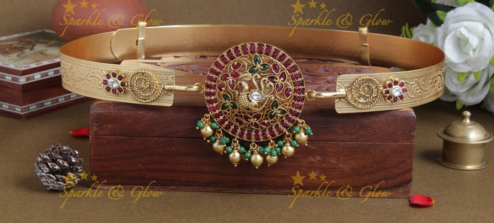 Intricately carved peacock pendent with plain hipbelt