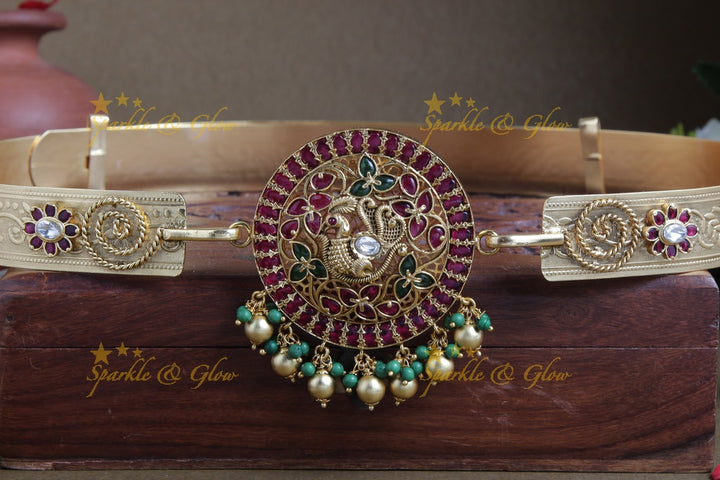 Intricately carved peacock pendent with plain hipbelt