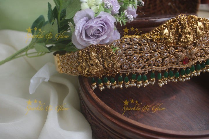 Gold alike AD stone beautiful intricately carved peacock lakshmi hipbelt with green beads