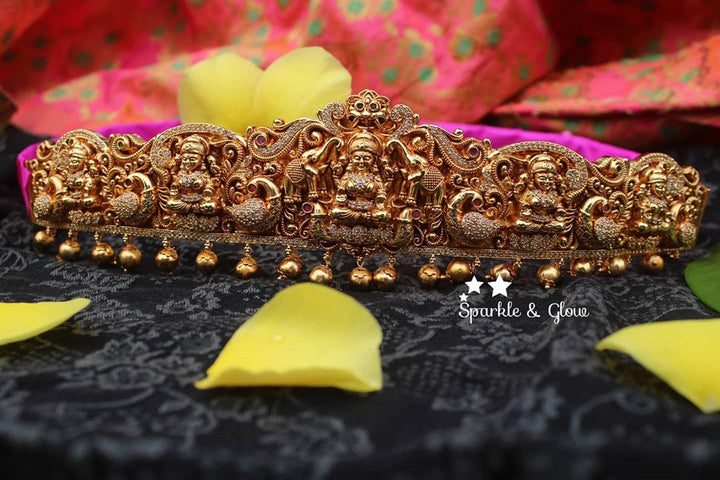 Gold alike polished carved intricately with Lakshmi , peacock and elephant hip belt